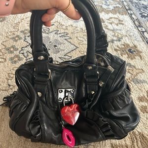 Betsey Johnson small black purse. Used but good condition.